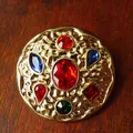 Close-up of vintage gold hammered brooch with colorful inset gemstones in royal style. - Style E Round Hammered (3.5x3.5cm)