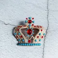Detailed close-up of a luxury Baroque crown brooch with red gems and turquoise beads - Cross Red Main Stone Style (5)