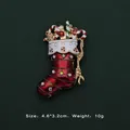 Detailed view of a festive Christmas stocking brooch with rhinestones and enamel. - Red Christmas Stocking Festive Style (5089421201394)
