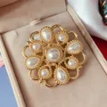 Exquisite close-up of a vintage Baroque gold-tone brooch with elegant faux pearls - Radiant Pearl Baroque (11)