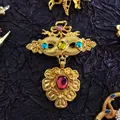Detailed view of a vintage gold-toned baroque brooch with vibrant colorful gemstones. - Bowknot Gem Pendant (08)