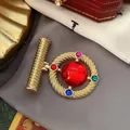 Detail view of a luxury vintage Baroque brooch with colorful gemstones and red center - Ruby Rope Baroque (12)