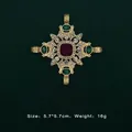 Detail of a vintage baroque gold brooch featuring red and green gemstone accents - Scroll Pattern Square Ruby Style (5089421201404)