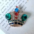 Vintage Baroque crown brooch featuring colorful green and red crystals on gold base - Multicolor Large Main Stone Crown Style (9)