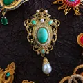 Luxurious baroque gold brooch featuring green gemstone and teardrop pearl pendant - Green Gem Drop Pendant (05)