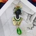 Vintage baroque style brooch with black bust and large green faceted crystal pendant - Baroque Blackamoor Bust (06)