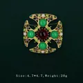 Elegant vintage Baroque gold brooch featuring green gemstones and white pearls for women - Cross Hollow Emerald Gemstone Style (5089421201406)