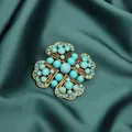 Macro detail of a vintage-style gold brooch with turquoise beads on elegant green silk - Sky Blue Cross Floral Style (Style 1)