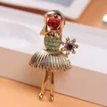 Detailed macro view of a vintage gold-toned girl brooch with rhinestone accents - Ballet Girl Shape (O5-1-5379)