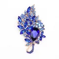 Elegant flower brooch featuring deep blue crystals and a large teardrop glass stone - Blue
