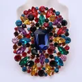 Elegant vintage multicolored crystal glass brooch featuring a large blue center stone - Colorful