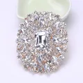 Ornate vintage crystal glass brooch featuring a large rectangular centerpiece for women - Gold