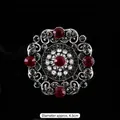 Broche vintage cristal baroque avec pierres rouges et gris fumé, environ 4,5 cm de diam. - Style 16