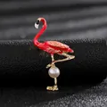 Detailed macro shot of an elegant red enamel flamingo brooch featuring a white pearl - Red Flamingo Pearl Style