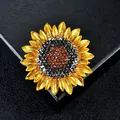 Luxury elegant sunflower brooch featuring gold-toned petals and sparkling amber crystals - Black Amber Sunflower Style