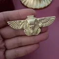 Detailed view of a vintage matte gold Egyptian pharaoh relief brooch with wings - Egyptian Pharaoh Wings Relief / Matte Gold