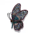 Detailed view of a vintage butterfly brooch with colorful rhinestones and hollow patterns. - Side-flying Large Butterfly / Blue Purple Edge