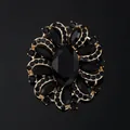 Elegant vintage black rhinestone flower brooch in gold-toned alloy for luxury wear - Black