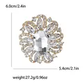 Elegant vintage gold-toned flower brooch with clear rhinestones and oval center stone - Gold / White Zirconia