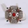 Detailed close-up of a vintage royal style brooch featuring red and green rhinestones - Vintage Court Geometric Style (01)