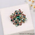 Elegant vintage alloy crystal flower brooch with colorful rhinestones on a white jewelry box - Vintage Rotating Multicolor Floral Style / 3cmx3cm