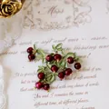Vintage forest style berry cluster brooch featuring red beads and green enamel leaves - Red Berry Brooch (Style 2)