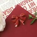 Exquisite baroque style red rhinestone bow brooch shown in a detailed close-up view - Red Bow