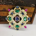 Vintage Baroque matte gold alloy brooch pin with green and blue gemstones for suits - Brooch