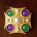 Close-up of vintage Baroque gold brooch with pearls, green and purple stones. - Style A (4.2x4.2cm)