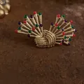 Close-up of elegant Baroque style vintage brooch featuring colorful decorative beads - Multicolor Fan Radiating Style