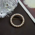 Detailed close-up view of a vintage Baroque style round pearl brooch pin for women. - Round Simple Baroque (SMT1005004046954097)