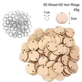 Close-up of 3cm round wooden tags with two holes and 1cm metal rings for DIY crafts - Round (50 Pieces) / 3x3cm