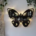 Detail view of butterfly wooden shelf with moon carvings and warm backlighting effect. - S / Butterfly