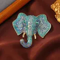 Vintage gouden olifant broche ingelegd met fonkelende blauwe en groene kristallen - Blauwe Strass Olifantenkop (15) / Blauw