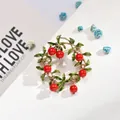 Elegant Korean style floral wreath brooch featuring red berries and green leaves - Berry Wreath Style (AL669301365390)