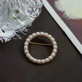 Vintage gold-tone round brooch adorned with elegant white pearls on a dark surface - Round Simple Baroque (SMT1005004046954097)