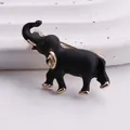 Vintage matzwarte olifant broche met gouden accenten en een groen kristallen oog - Zwarte Matte Olifantenkop (16) / Zwart