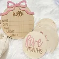 Professional wooden baby milestone card set with pink bow and hello announcement plaque - Natural Wood Style