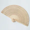 Close-up detail of an intricate laser-cut floral pattern on a natural wooden folding fan - 20cm / Natural Wood Color