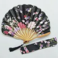 Detailed view of a black Japanese floral folding fan with its matching fabric sleeve - No.1 Black / Single Piece (With Bag)