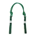 Detailed macro view of green patterned woven nylon strap with clear plastic buckles - Green And Pink Strap