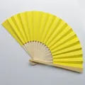 Close-up view of a bright yellow bamboo folding fan showing the texture and structure. - Lemon Yellow