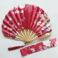 Detailed view of red floral satin kimono fan with bamboo ribs and matching fabric sleeve. - No. 14 Wine Red / Single Piece (With Bag)