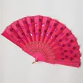 Macro detail of a bright pink folding fan with shimmering purple sequins and gold lace. - Rose Red