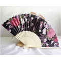 Elegant black silk folding fan with pink floral pattern and natural bamboo ribs - Black