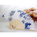Elegant traditional silk folding fan with blue floral patterns and sturdy bamboo handle - Blue and White Porcelain Style