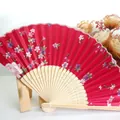 Elegant 21cm Japanese folding fan featuring red cherry blossom silk and natural bamboo ribs - Size 7 / Red