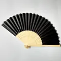 High quality detailed view of an elegant black silk folding fan with natural bamboo frame - Black (No.1)