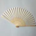 Detailed view of white silk folding fan with intricate bamboo carvings - Beige (No.7)