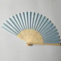 Detailed view of light blue silk folding fan with intricate hollowed bamboo ribs. - Light Blue (No.9)